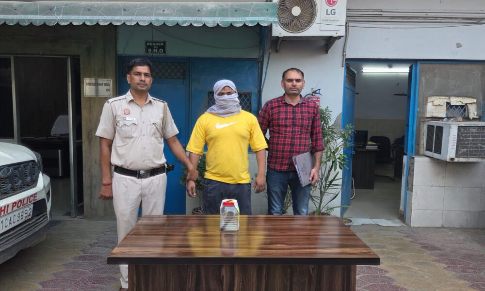Police with two detained individuals.