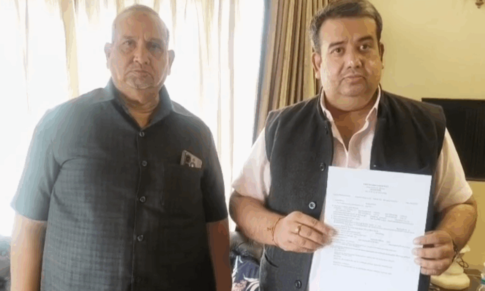 Two men holding a document.