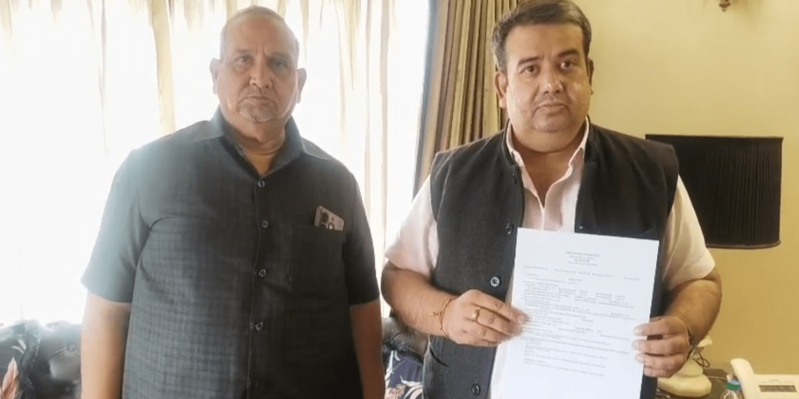 Two men holding a document.